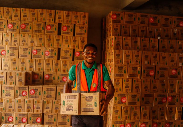 Warehouse worker packing an order during processing time before it ships